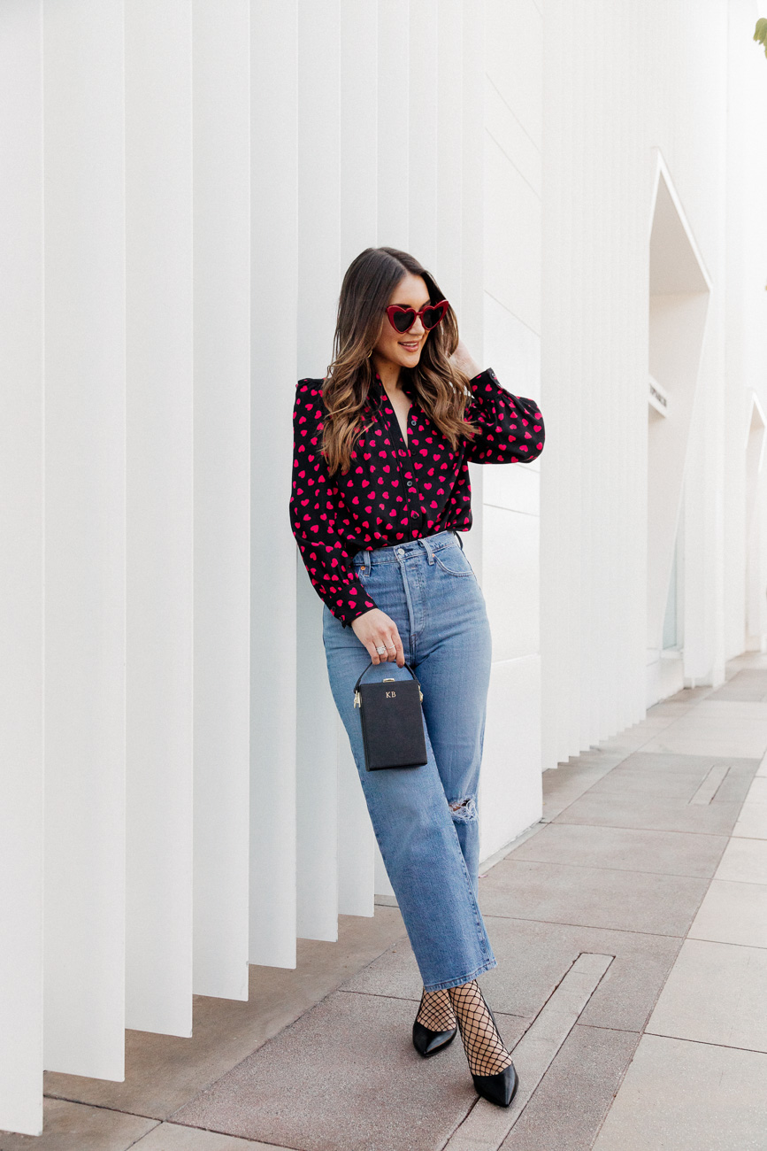 Polka Dot Blouse with High-Waisted Jeans and Black Heels